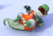 a cartoon character is laying on its back with its mouth wide open