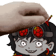 a person is petting a cartoon character 's head with a hat on .