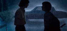 two people standing in front of a car with the words you 're destroying everything and for what