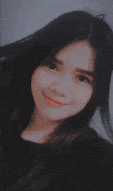 a woman with braces on her teeth smiles behind a grid of sparkles