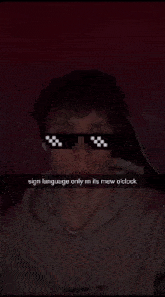 a man wearing sunglasses says sign language only m its mew o clock