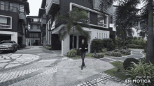 a woman is walking in front of a building that says made in animotica