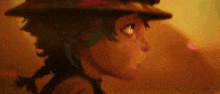 a close up of a person wearing a hat and looking at the camera .