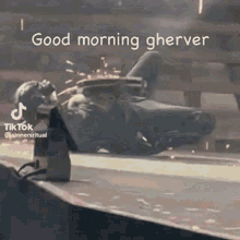 a man is cutting a piece of metal with a grinder and says `` good morning gherver '' .