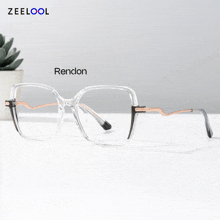 a pair of clear glasses with randon written on the bottom