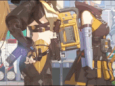 a woman in a black and yellow outfit has a blue item on her sleeve that says ' l ' on it
