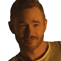a close up of a man 's face with a beard