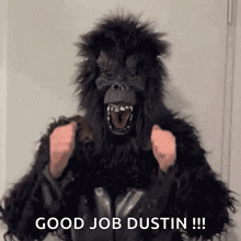 a person in a gorilla costume is giving a thumbs up