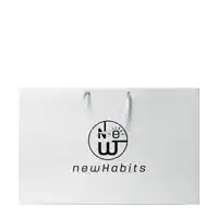 a white bag that says new habits on the front