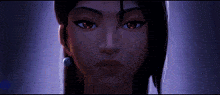 a close up of a woman 's face with her eyes closed in a dark room .