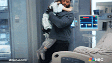 Carrying A Child Kevin Atwater GIF - Carrying A Child Kevin Atwater Chicago Pd GIFs