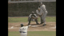 a baseball player wearing a white jersey with the number 2 on it