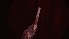a man in a cowboy hat is holding two guns