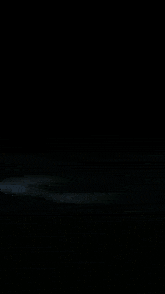 a close up of a fireball with a dark background