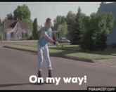 a person rollerblading on a street with the words on my way written below them