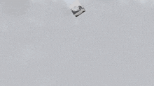 a cube with a picture of a person on it floating in the air