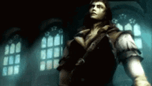 a man is standing in a dark room with a sword in his hand .