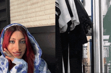a woman with red hair is wearing a blue hooded jacket
