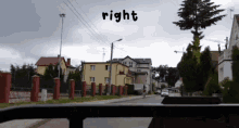 a view of a street from a car with the words right above it