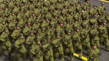 a large group of soldiers marching in a line with their guns