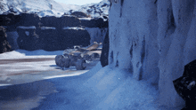 a car is driving through a snowy area with icicles on the rocks