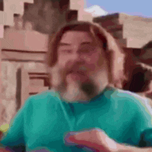 a blurry picture of a man with a beard and long hair