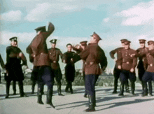 a group of soldiers are dancing together in a circle