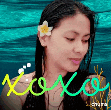 a woman with a flower in her hair and the words xoxo chums on the bottom