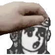 a hand is touching a cartoon character 's face in a black and white image .