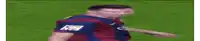 a man in a soccer uniform is standing on a field .