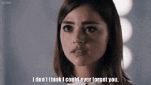 a woman says " i don 't think i could ever forget you " in front of a bbc logo