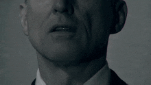 a close up of a man 's face with the word ustach in white
