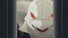 a close up of a person 's face with red eyes