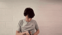 a blurry picture of a person 's face with a white wall in the background