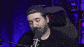 a man speaking into a microphone with the words do n't sleep on gay rights written above him