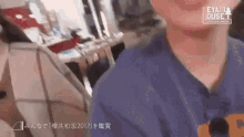 a close up of a person 's face with a sign that says heya house on it