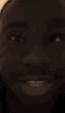 a close up of a man 's face with his mouth open and his eyes looking up
