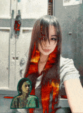 a woman with a scarf around her neck has a picture of another woman in the background