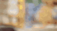a blurry picture of a person 's feet and a pair of sandals
