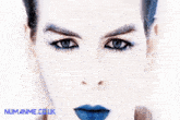 a close up of a woman 's face with numanne.co.uk written in blue