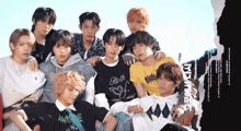a group of young men are posing for a photo and one of them has a shirt that says birth