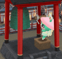 a cartoon character in a pink hat is hanging from a bell