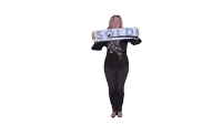 a woman in a black top is holding a sign that says u tos