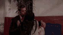 a man and woman are standing next to each other