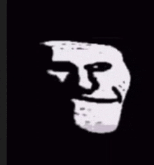 a black and white drawing of a troll face with a smile .