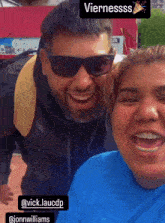 a man wearing sunglasses and a woman wearing braces are posing for a picture