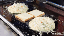 sandwiches are being cooked on a grill and the words made in animotica can be seen in the corner