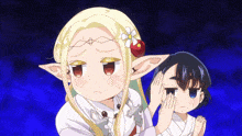 a girl with elf ears and a flower in her hair is standing next to another girl