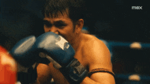 a shirtless man in a boxing ring with a max logo on the bottom