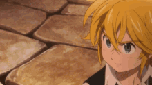 a close up of a cartoon character with yellow hair